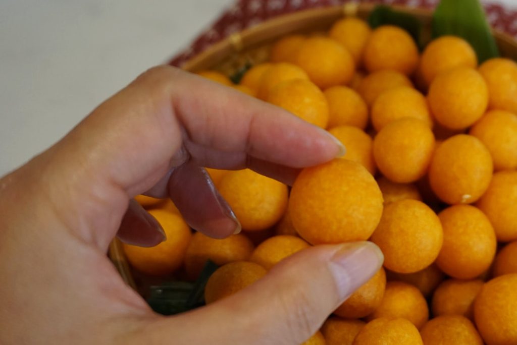 Fried Sweet Potato Balls: Kanom Kai Nok Kra Ta - Lion Brand