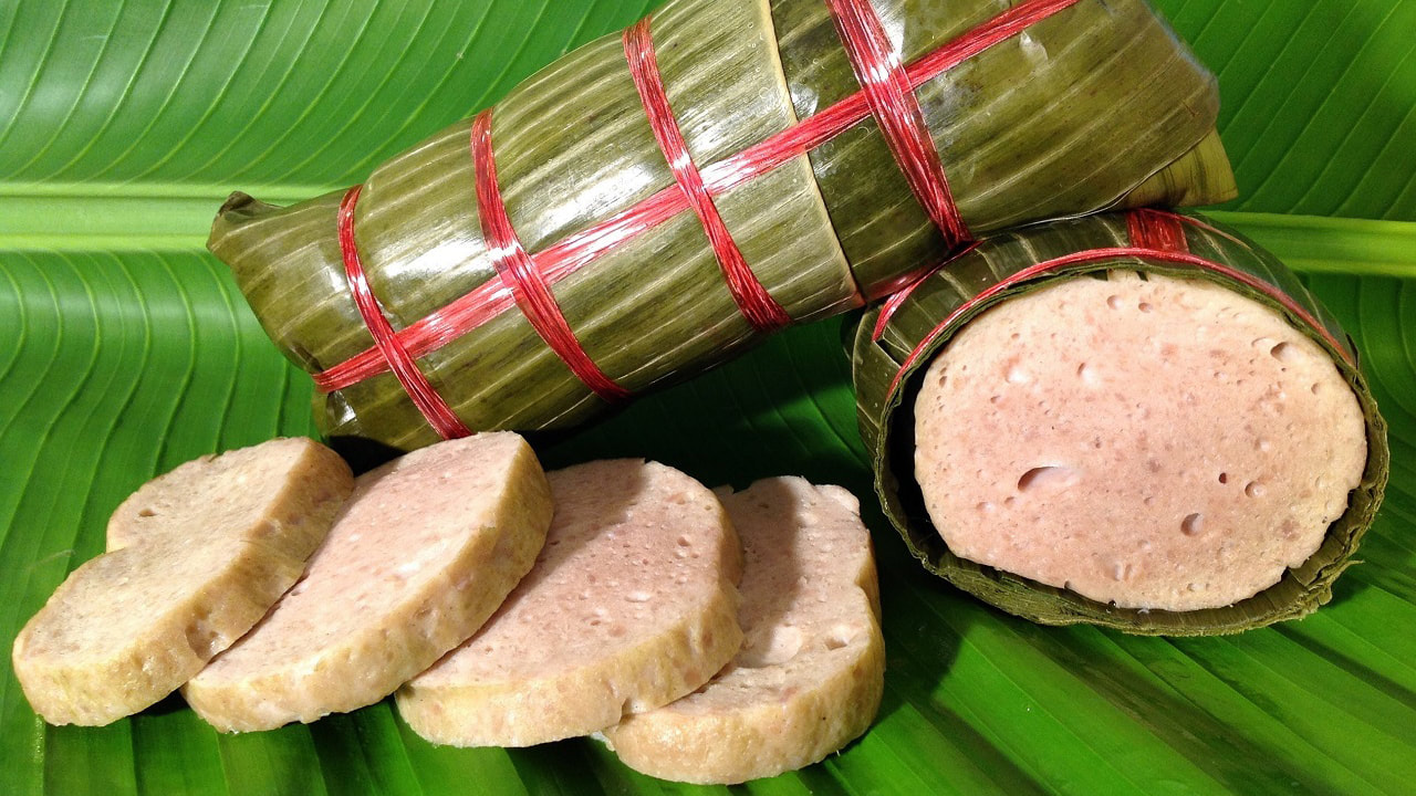 Chả lụa, a cooked pork roll lightly seasoned with fish sauce, and traditionally steamed or boiled in a banana leaf